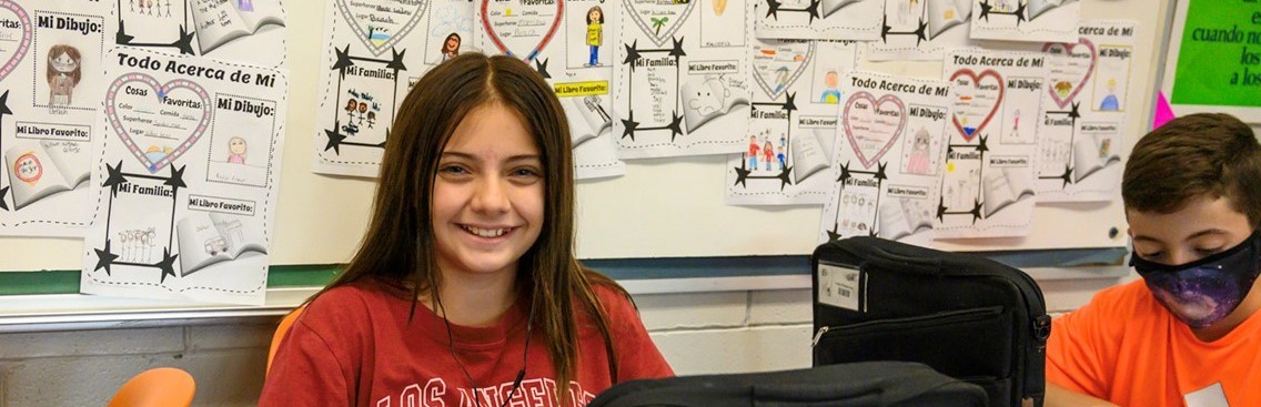 middle school girl wearing a red t-shirt