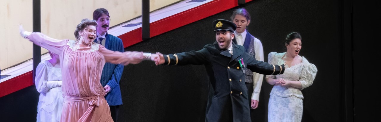 Captain and lady dancing in scene from Titanic the Musical