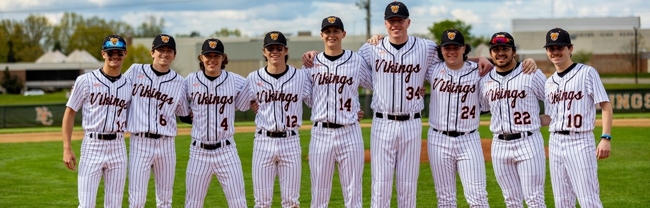 High school senior baseball players standing in a line