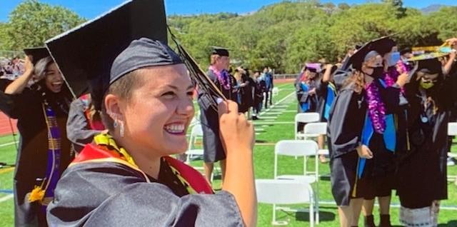 grinning graduate girl