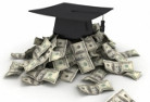 A graduation cap sitting atop stacks of money.