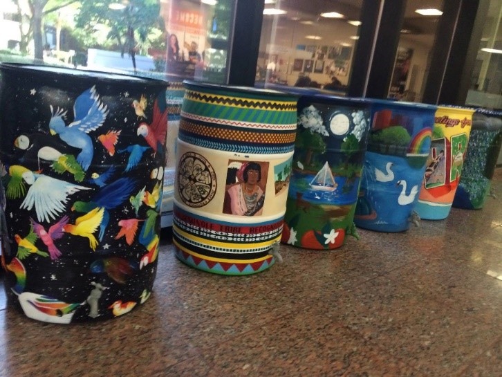 image of student painted rain barrels