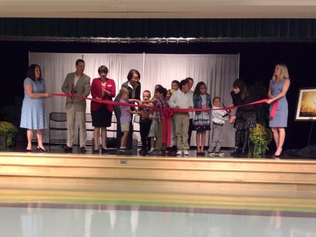 cutting the ribbon at dedication