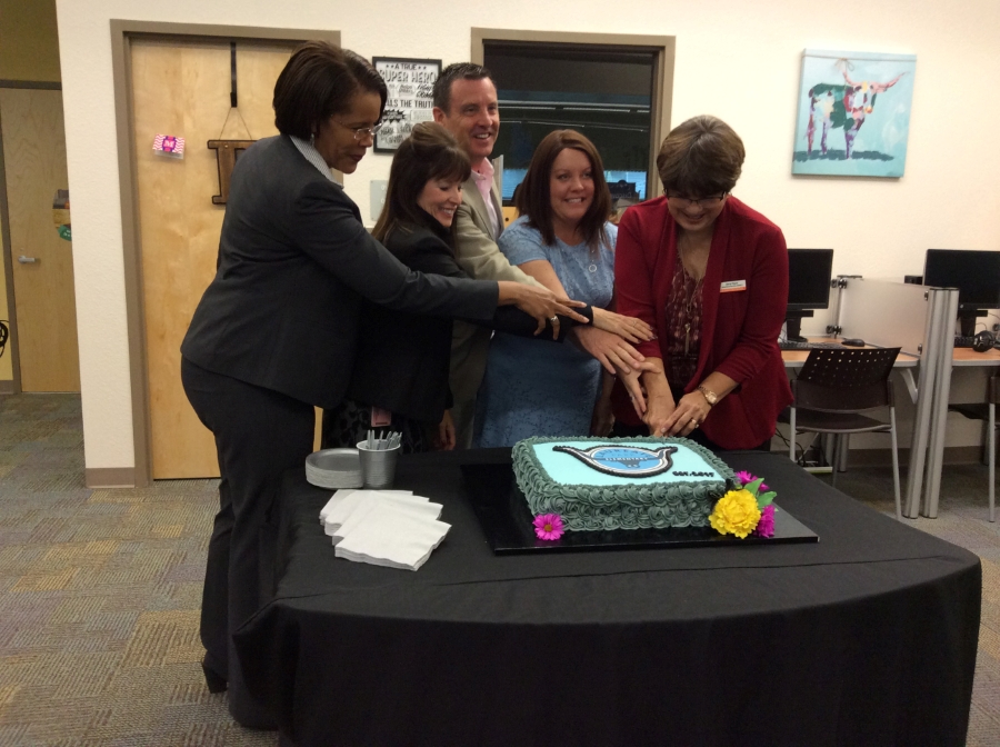 cutting the cake at dedication