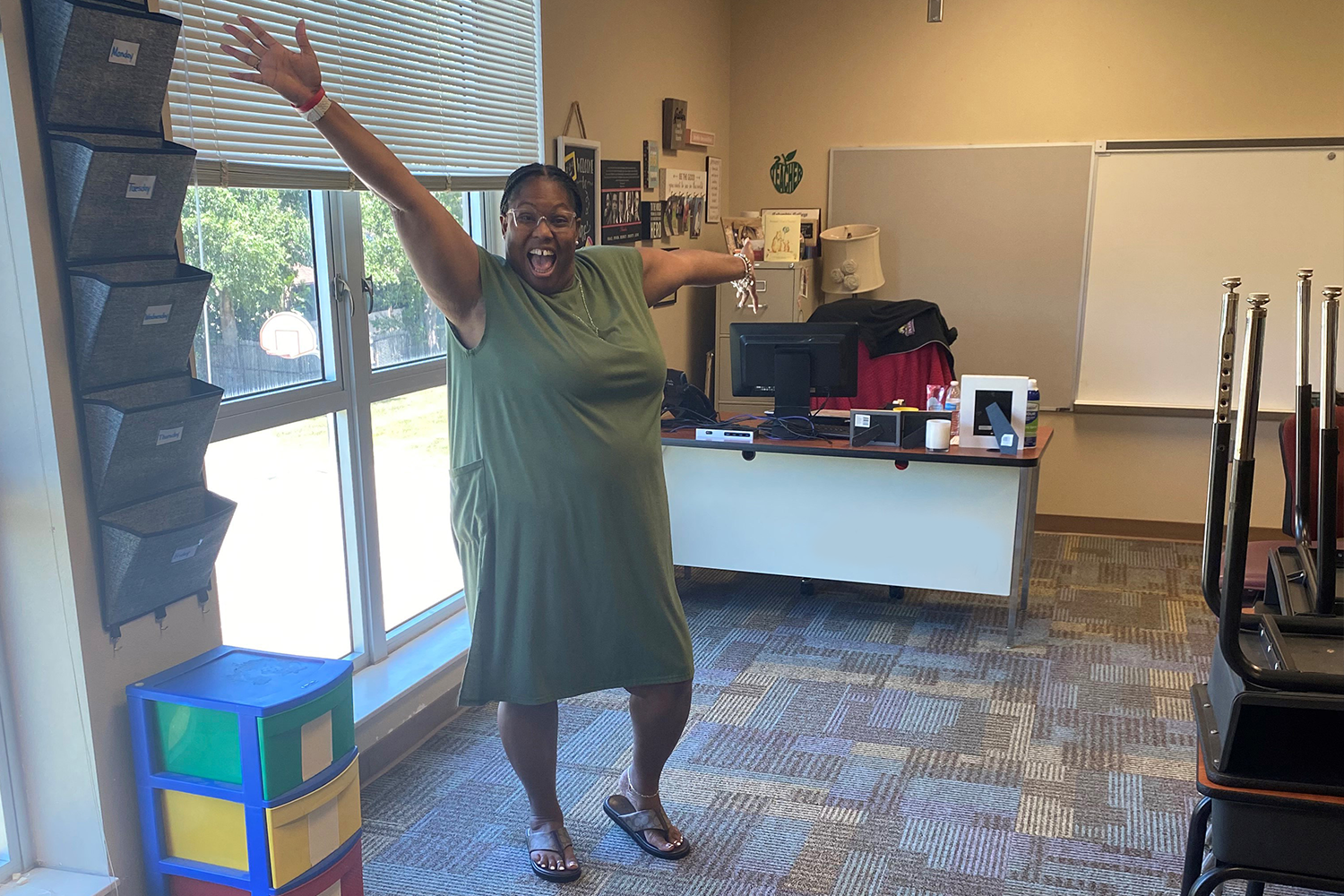 Jill Robbins stands in her new carpeted classroom.