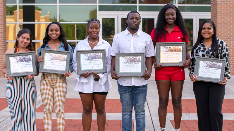 Six students pose for a photo