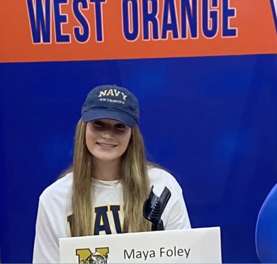 a female wears a Navy hat