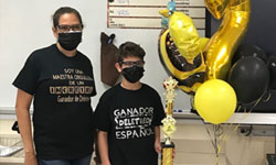 2nd place winner Diego Galán Reyes (right) poses with his teacher and his trophy