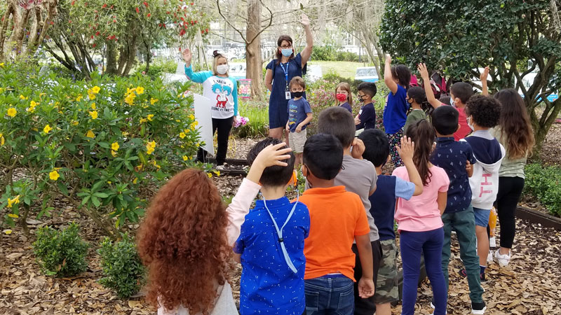 Students in line waiting for StoryWalk to begin