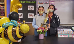 Leandria Negrón-Ramos (left) poses with her teacher and her first place trophy