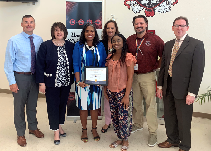 7 people smile with certificate for Union Park MS