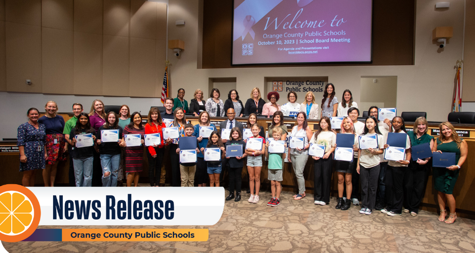 Large group of students and adults hold certificates