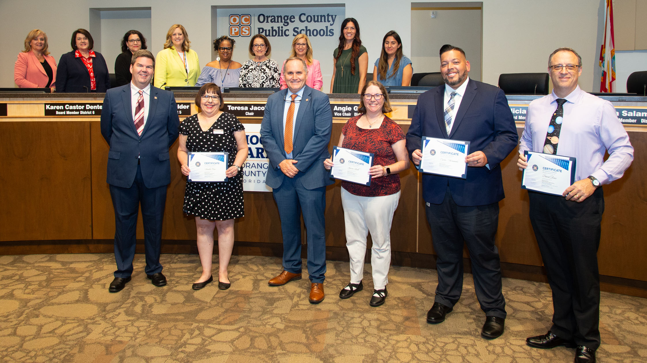 Group poses with certificates