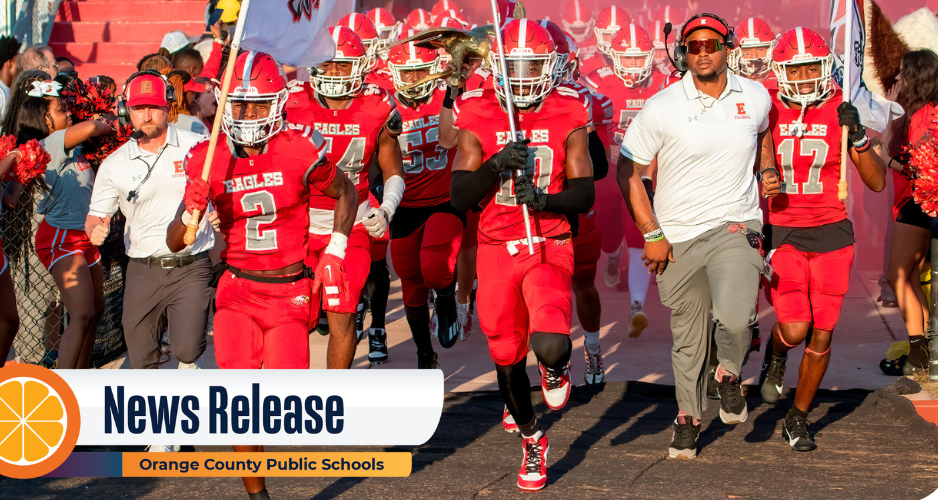 Edgewater players and coaches running onto field