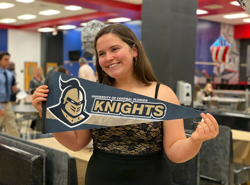 Student holds UCF pennant