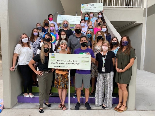 Audubon Park Green team holds check