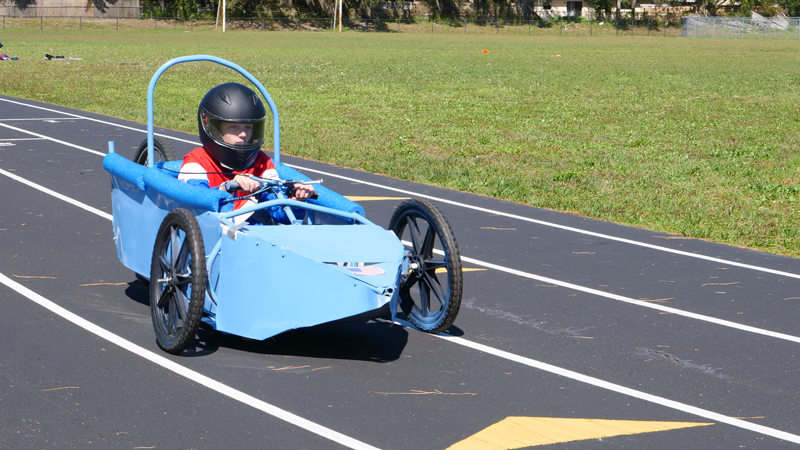 A student drives an electric car