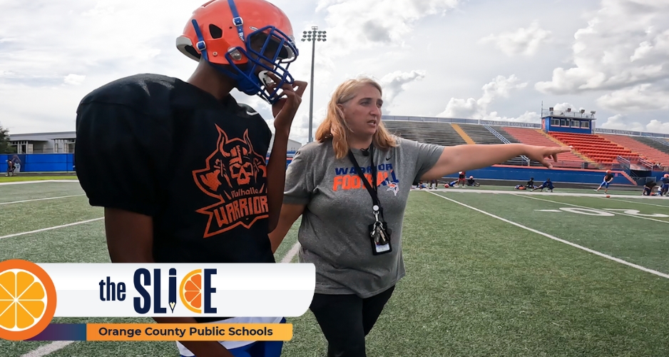 Mandi Brown helps player during football practice