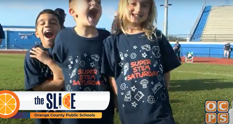 Three students smiling in STEM shirts