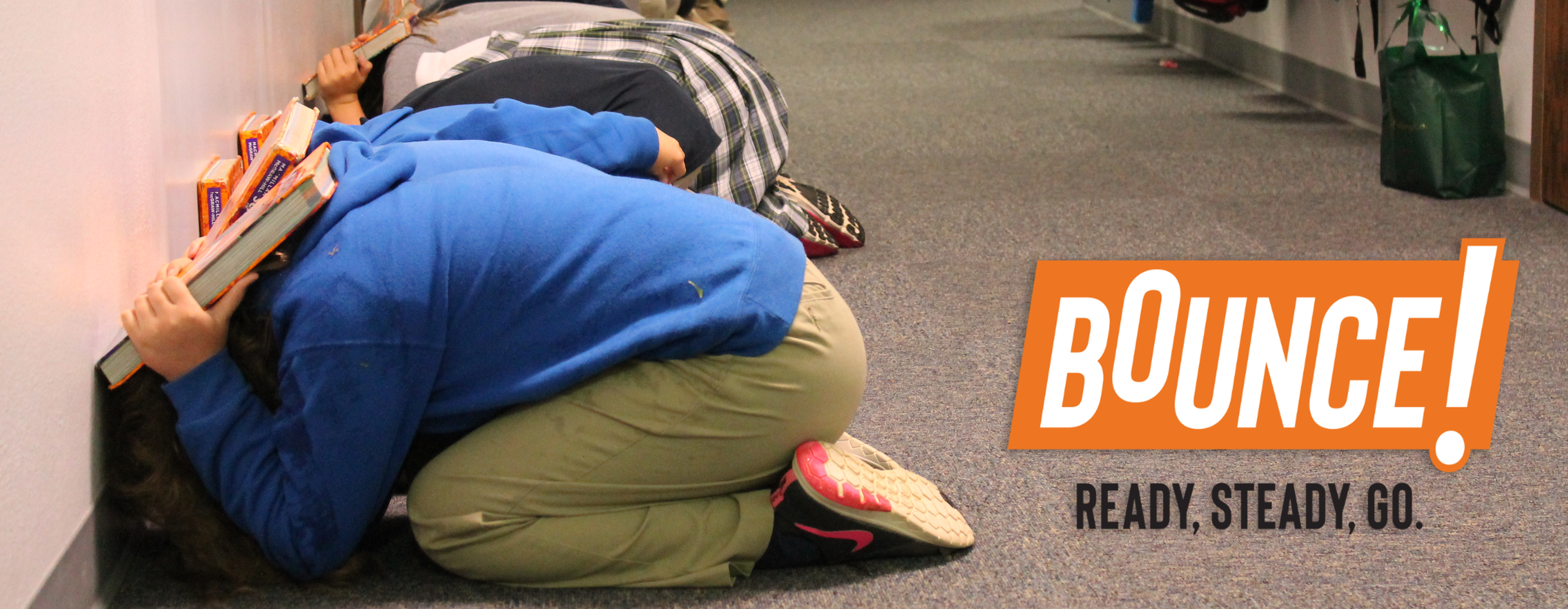 Students during a tornado drill in a hallway