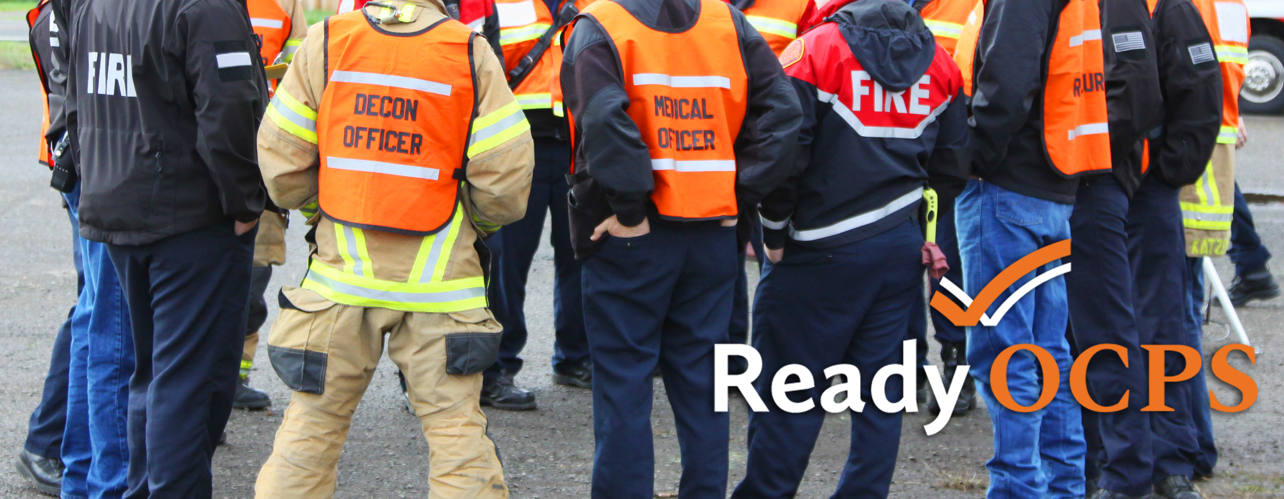 Emergency response personnel in a group huddle