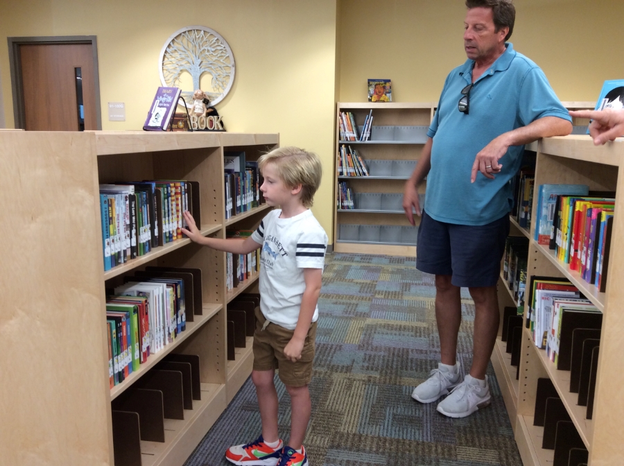 father and son in media center