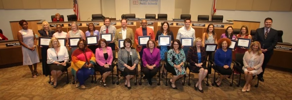 Large group of people pose for a photo Large group of people pose for a photo