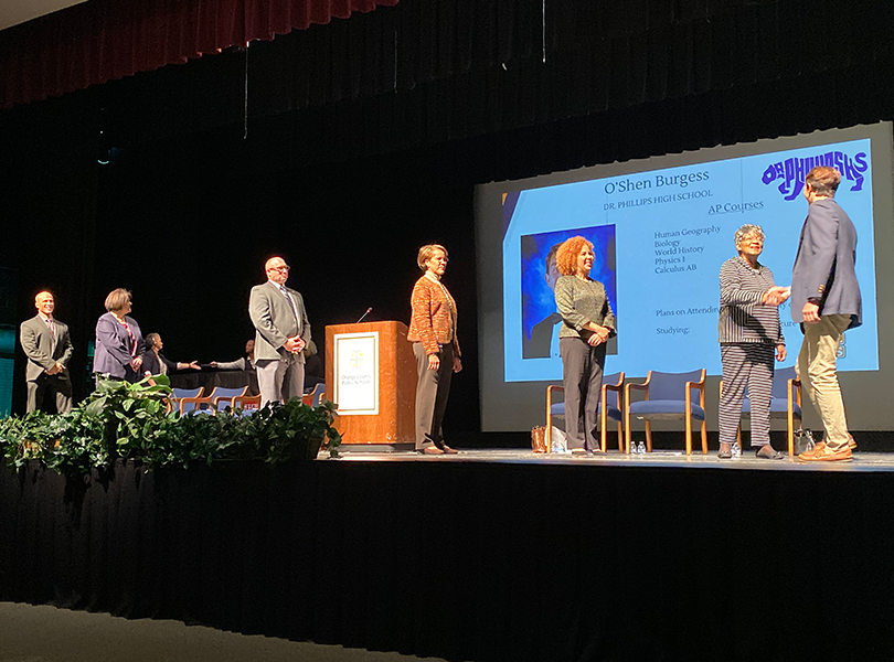 Student walks across the stage Student walks across the stage