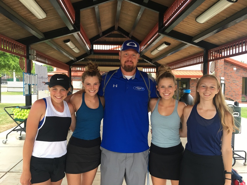 Tennis team with their Head Coach