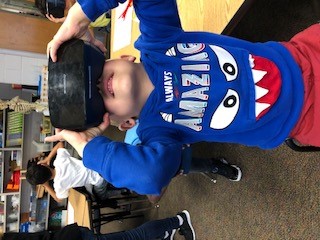 Kindergarten student uses a virtual reality device.
