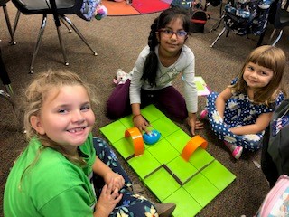 Students participate in a coding activity.