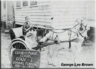 Black and white photo of early 1900s Conway student in cart pulled by a goat. Black and white photo of early 1900s Conway student in cart pulled by a goat.