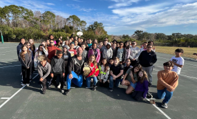 Mr. Whitney with a group of students.