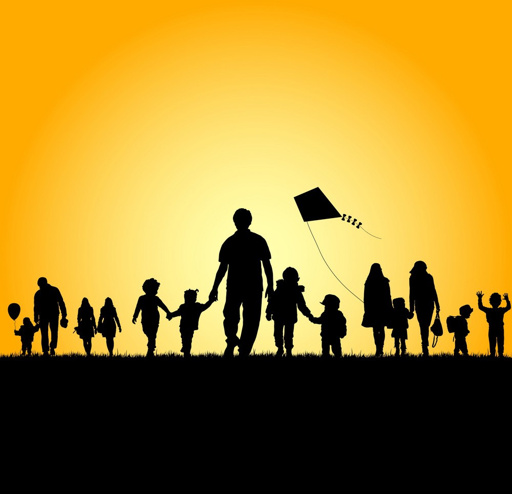 Children flying a kite against a sunset Children flying a kite against a sunset