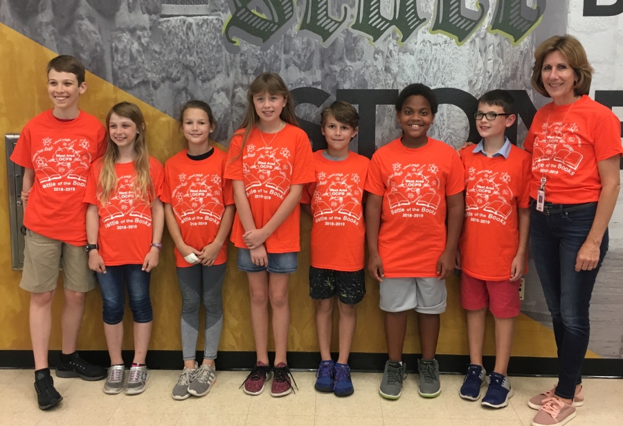 Battle of the Books Team Wins West Area Tournament standing with Mrs. Dobson