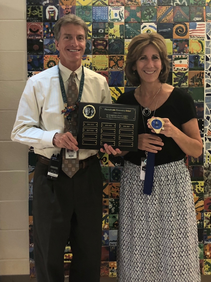 Mr. Daniels and Mrs. Dobson holding Chess Tournament Plaque