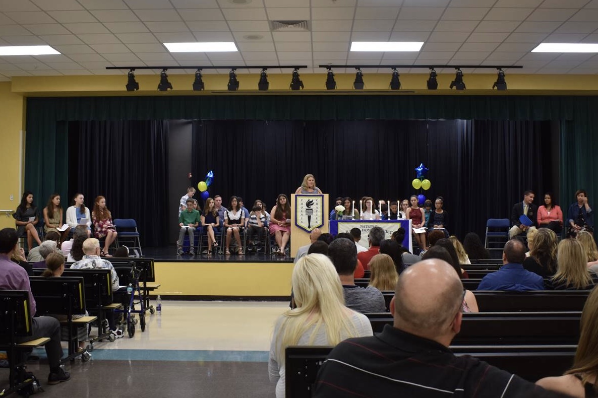 NJHS Ceremony with Ms. Reilly at podium