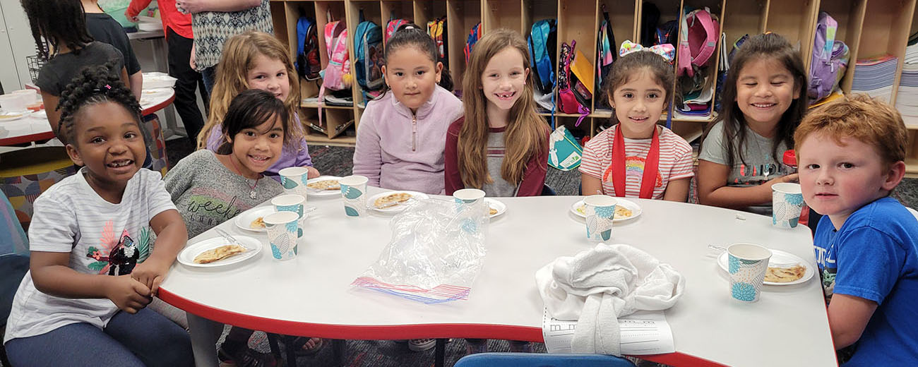 STUDENTS around table