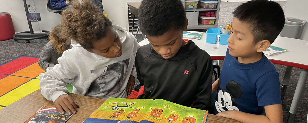 reading buddies read a book together