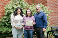 Student Mila Yurter with staff, and her artwork thumbnail265562