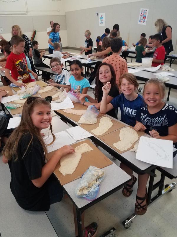 Students making state maps with salt dough
