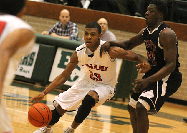 This is the image for the news article titled BOYS BASKETBALL: Dyer Flies High, But Trojans Dealt Playoff Tumble