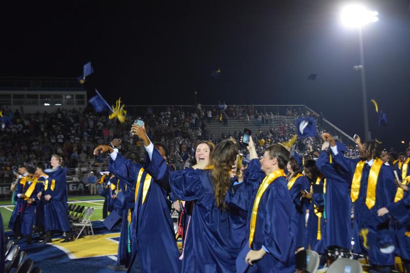 GHS Graduates throwing their caps in the air