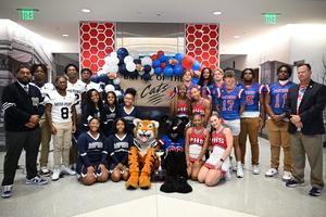 PHS and Moss Point students smile at camera
