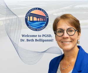 Dr. Beth Bellipanni smiles in front of a backdrop of the Singing River