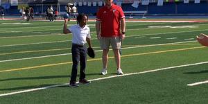 girl throwing softball for special olympics
