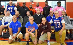 Students and staff with shaved heads