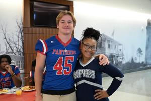 boy and girl smile at camera