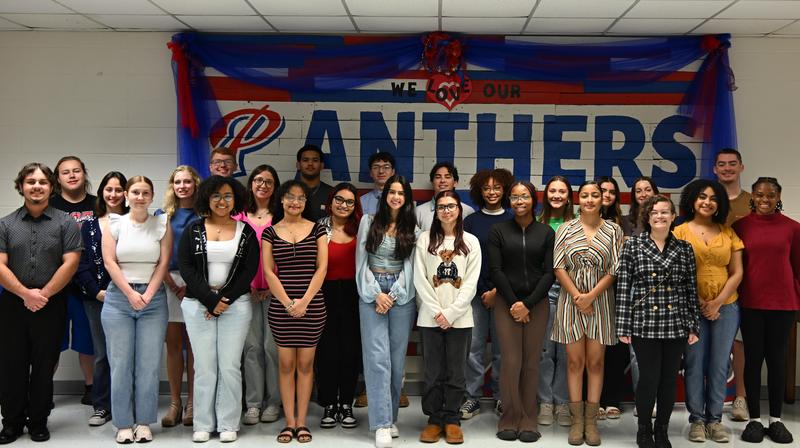 All 27 seniors who are a part of the PHS Class of 2025 Top 10% smile