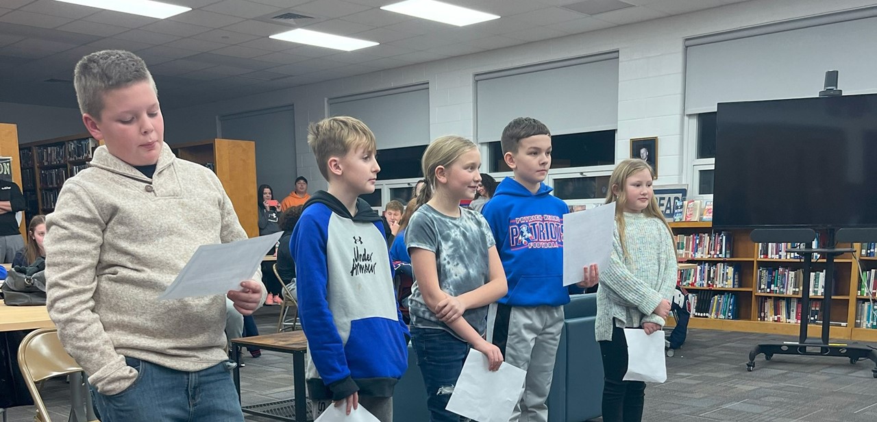 Elem students speaking at a board of education meeting